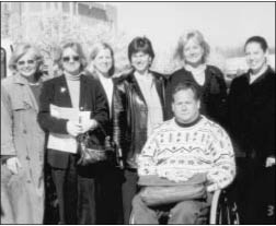 Photo of Theda Ellis, Pat Maichles, Beth Mineo, Debbie Whitby Norman, Dawn Stewart, and Eden Melmed; (front row) Griff Campbell. Not pictured: Zoan Thomas El, Howard Shiber, Sonja Simowitz, and Joann McCafferty