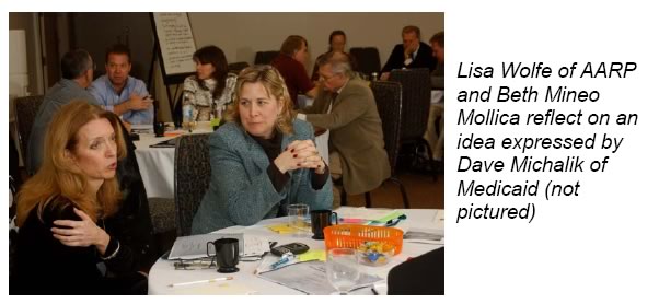 Photo: Lisa Wolfe of AARP and Beth Mineo reflect on an idea expressed by Dave Michalik of Medicaid (not pictured)